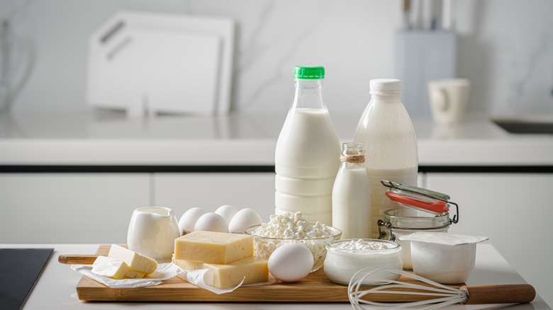 Various dairy products on a chopping board