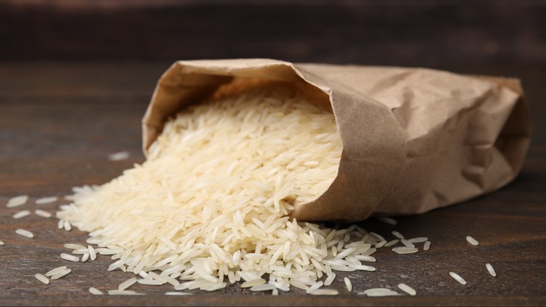 Rice pouring out of a paper bag