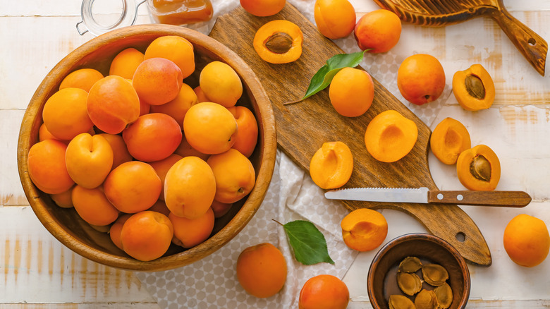 Apricots on cutting board.