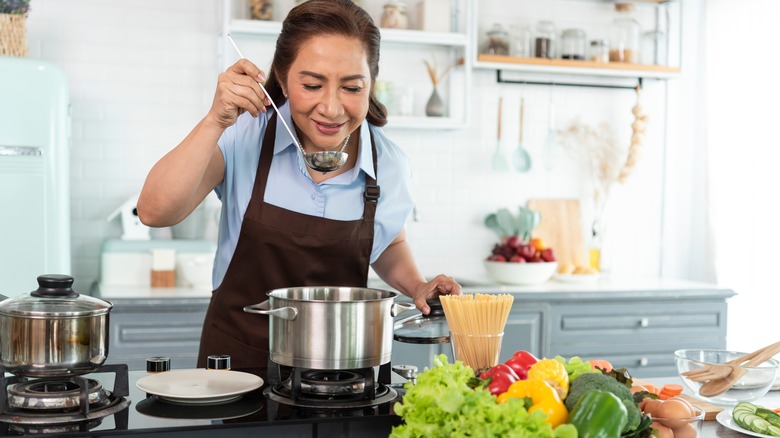 woman making soup