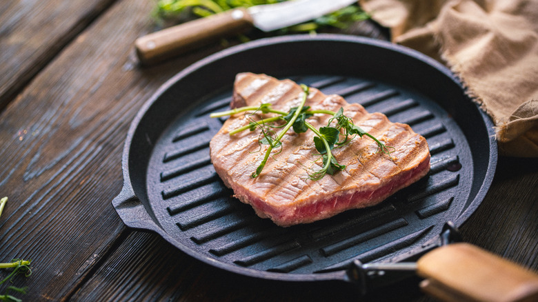 Whole tuna steak in pan