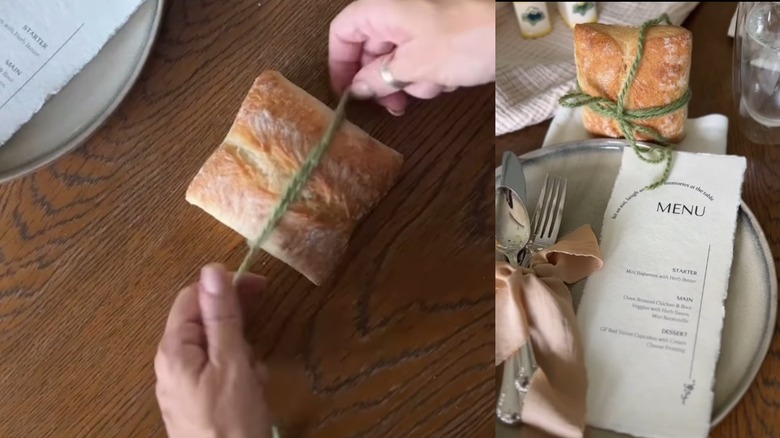 Dinner rolls ties with green yarn at a table setting