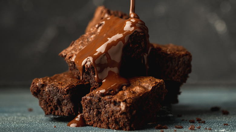 stacked brownies with chocolate sauce