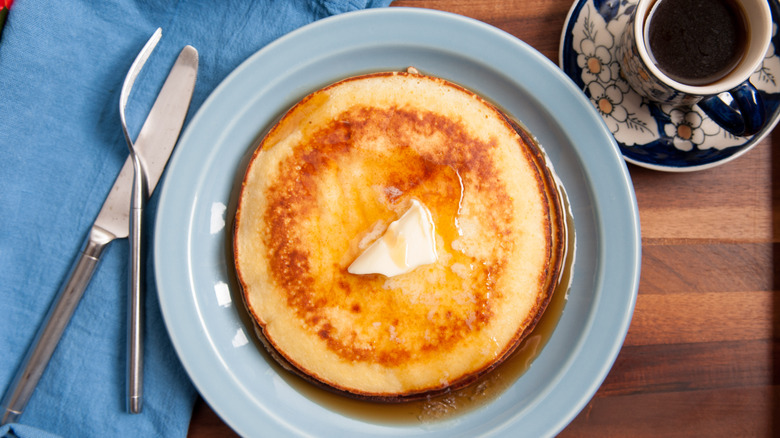 one crisp, fluffy pancake on blue plate