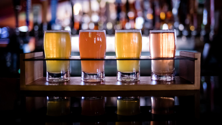 Flight of four beers at a bar