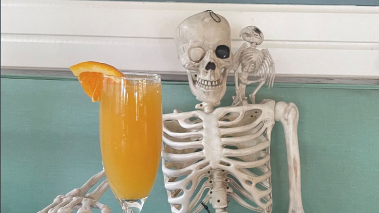 skeleton enjoying a mimosa