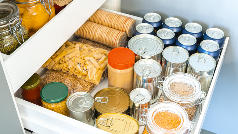 Cans and dried goods in deep drawer