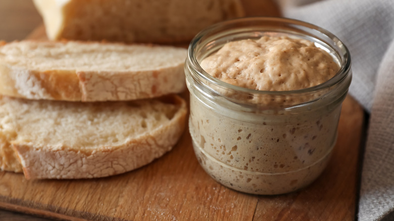 Close-up of a sourdough starter in a glass jar