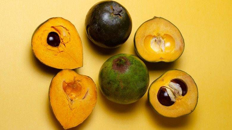 whole and halved fresh lucuma