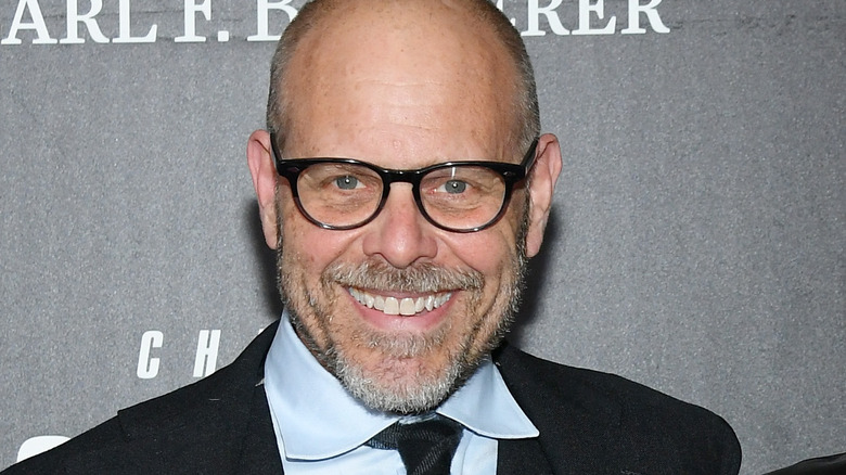 Alton Brown smiling with glasses