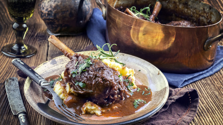 lamb shanks and mash on plate