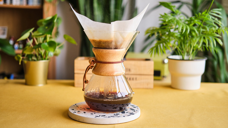 Chemex coffee maker brewing coffee.