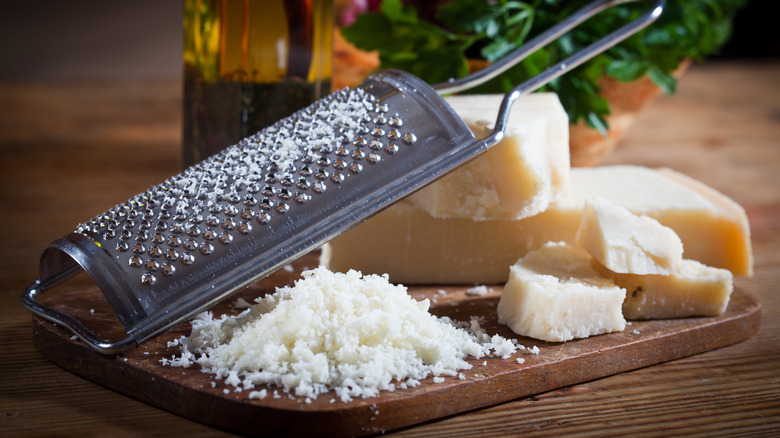 Grated cheese on a wooden board 