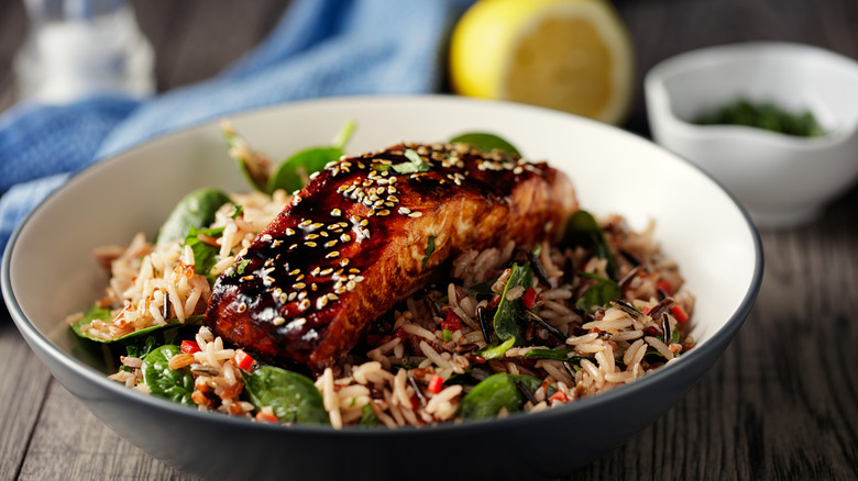 salmon in bowl with rice and spinach