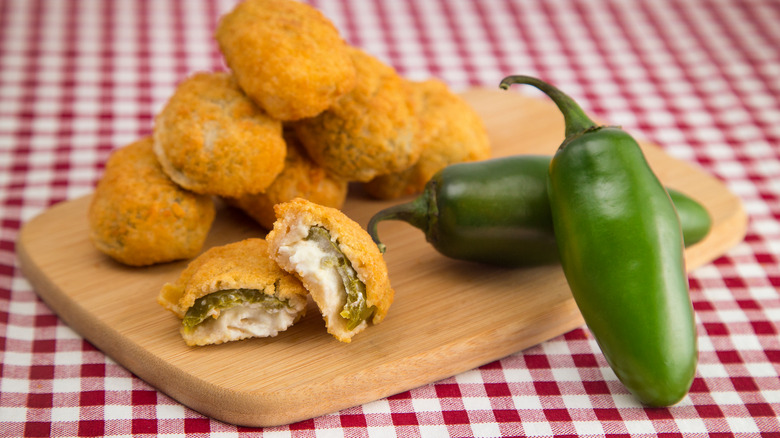 jalapeno poppers on wood board