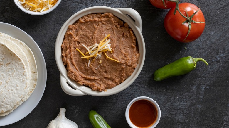 refried beans, hot sauce, jalapenos, tomato