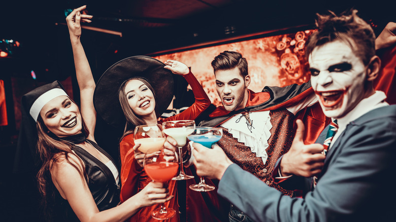 people in costumes with drinks