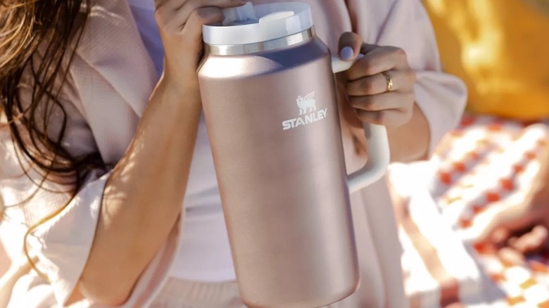 Woman drinking rose quartz Stanley