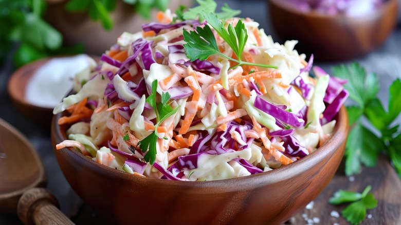 Coleslaw in a wooden serving bowl