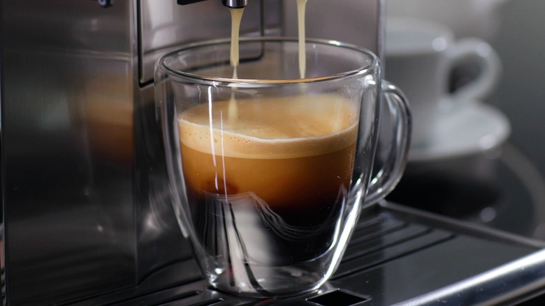 Espresso shot being dispensed by machine