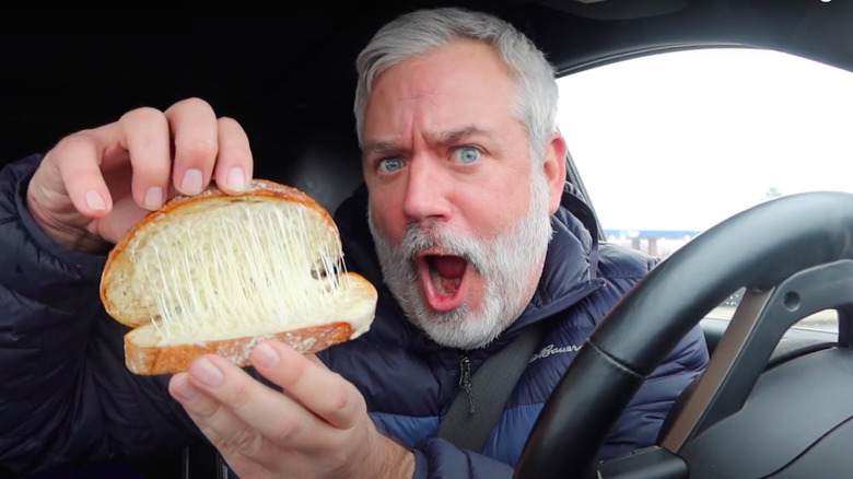 man taste testing Starbucks grilled cheese