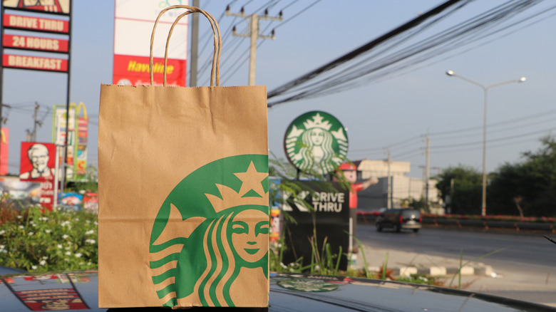 Starbucks to go bag on table 