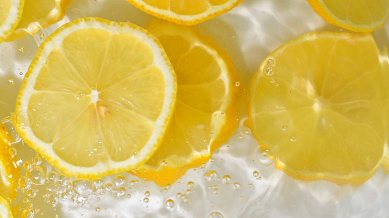 close up of lemon slices in liquid