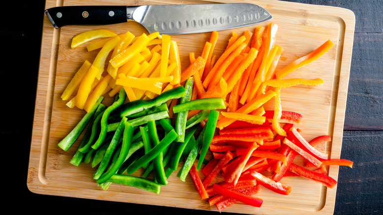 sliced peppers on cutting board