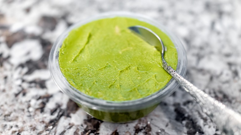 container of store-bought guacamole