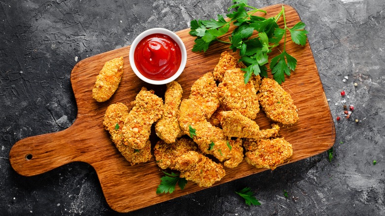 Breaded chicken tenders on board