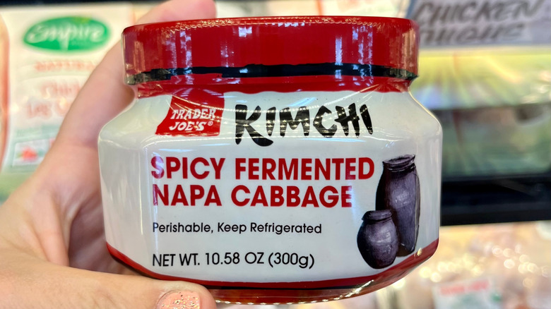 hand holding Trader Joe's kimchi