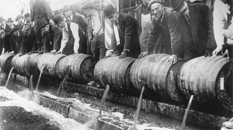 Men pouring out alcohol prohibition