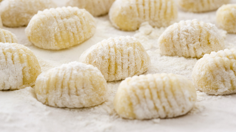 Fresh homemade gnocchi on a sheet of wax paper