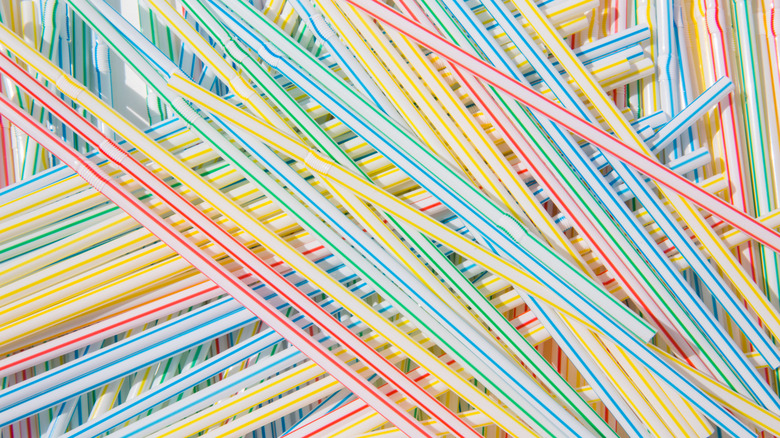 Colorful plastic straws as background