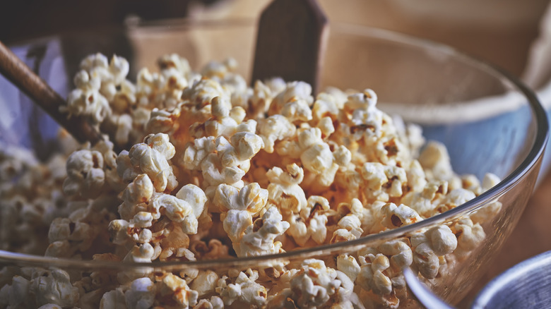 tossing bowl of kettle corn