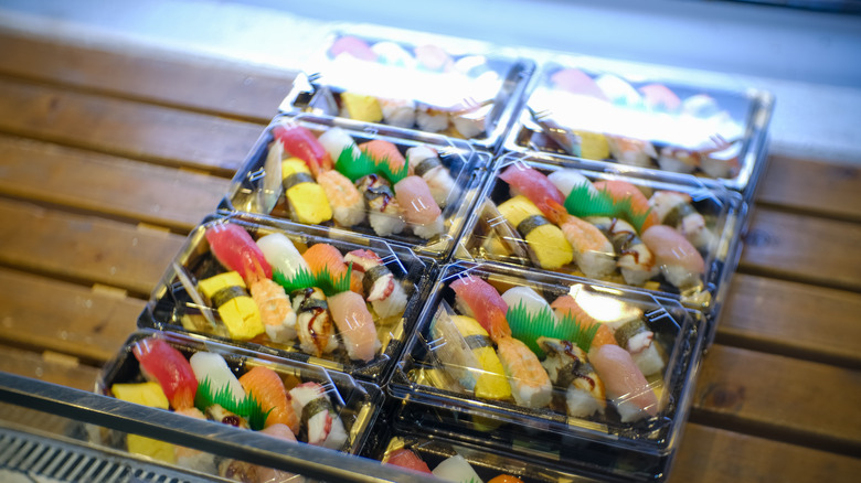 sushi in plastic boxes