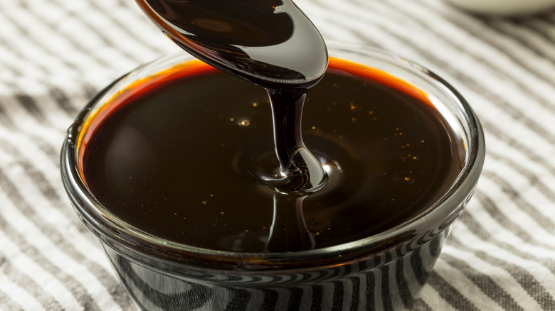 spoon dipping out molasses