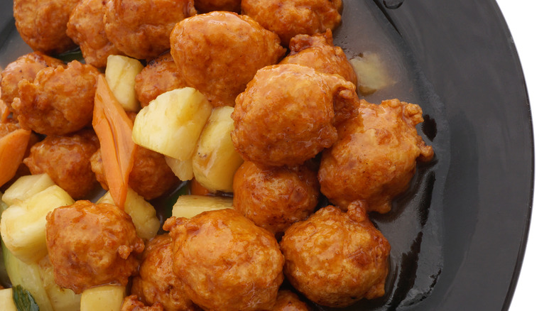 Close-up of meatballs with pineapple 