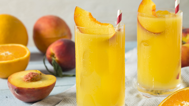 fuzzy navel cocktail with peaches