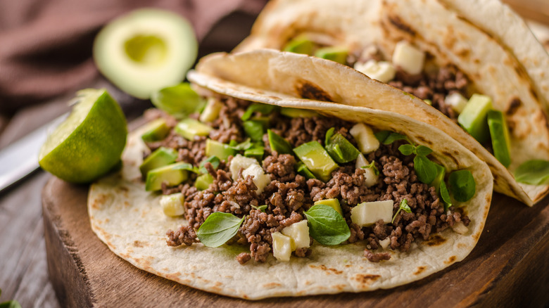 Mexican tacos with beef and avocado