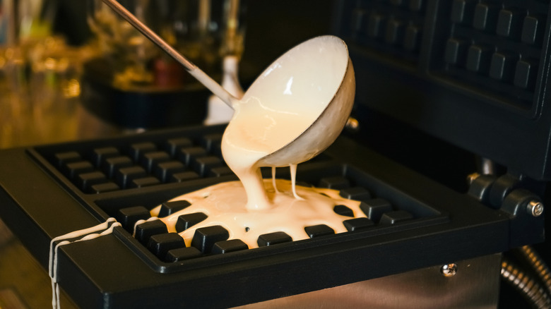 Pouring batter in waffle iron