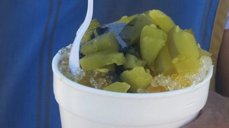 A piccadilly snow cone topped with chopped pickles