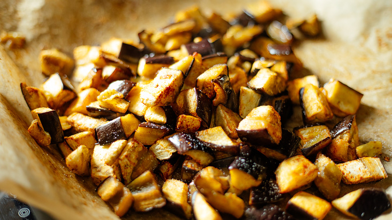 baked eggplant cubes on parchment paper