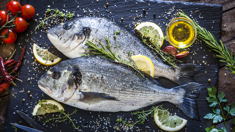 Two whole fish with herbs and spices