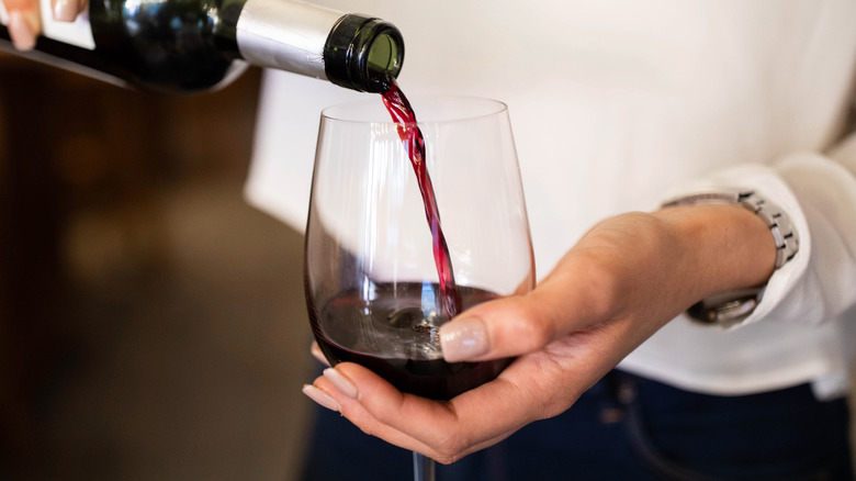 red wine being poured into glass