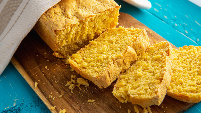 cornbread on wood board sliced