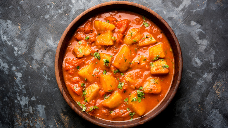 Dum Aloo in a wooden bowl