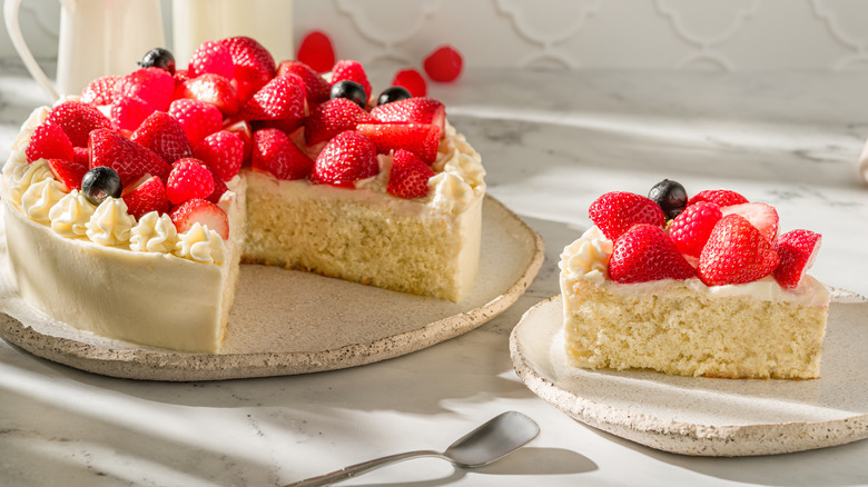 cake topped with strawberries with milk