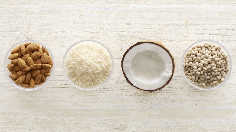 almonds, rice, coconut, soy beans in bowls