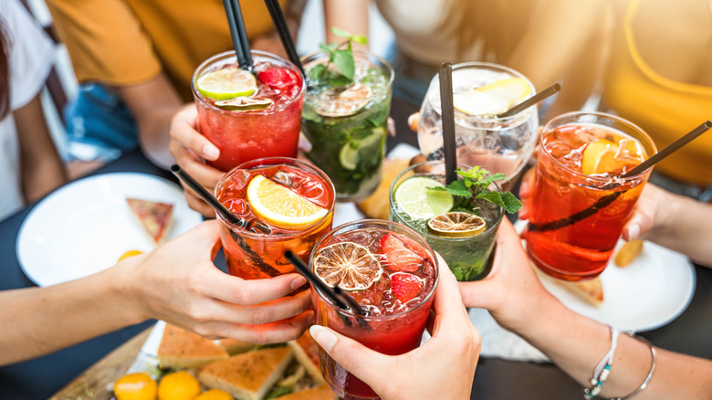 people cheers with miscellaneous cocktails